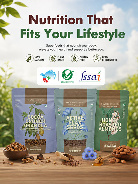 Three stand-up pouches of Nutrien Organic superfoods are displayed on a wooden table with bowls of nuts, seeds, and honey against a blurred green outdoor background. The products are Cocoa Crunch Granola, Active Flax Seeds, and Honey Roasted Almonds.